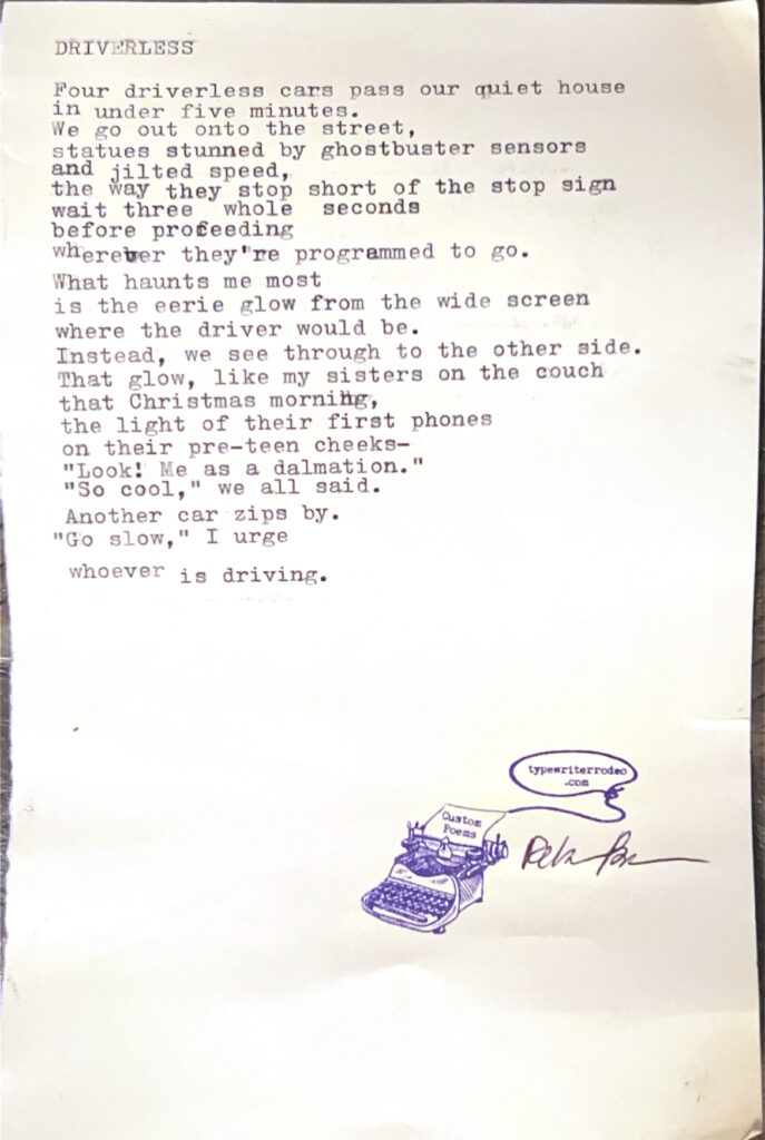A photo of the typewritten poem on a torn half sheet of light yellow paper.